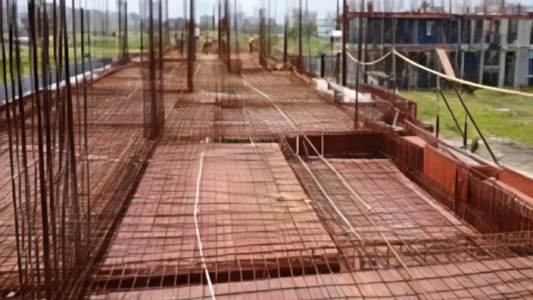 RCC foundation reinforcement and steel bar placement at construction site