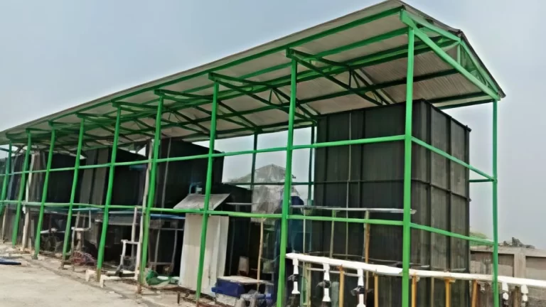Industrial steel structure construction project with green framework installation